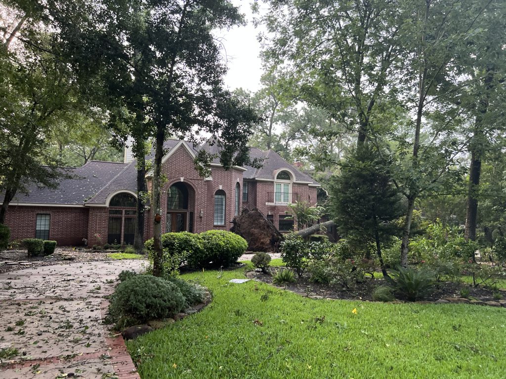 Houston Storm Damage Repair - Broken windows, missing shingles, and debris scattered around, highlighting the urgent need for professional storm damage repair.