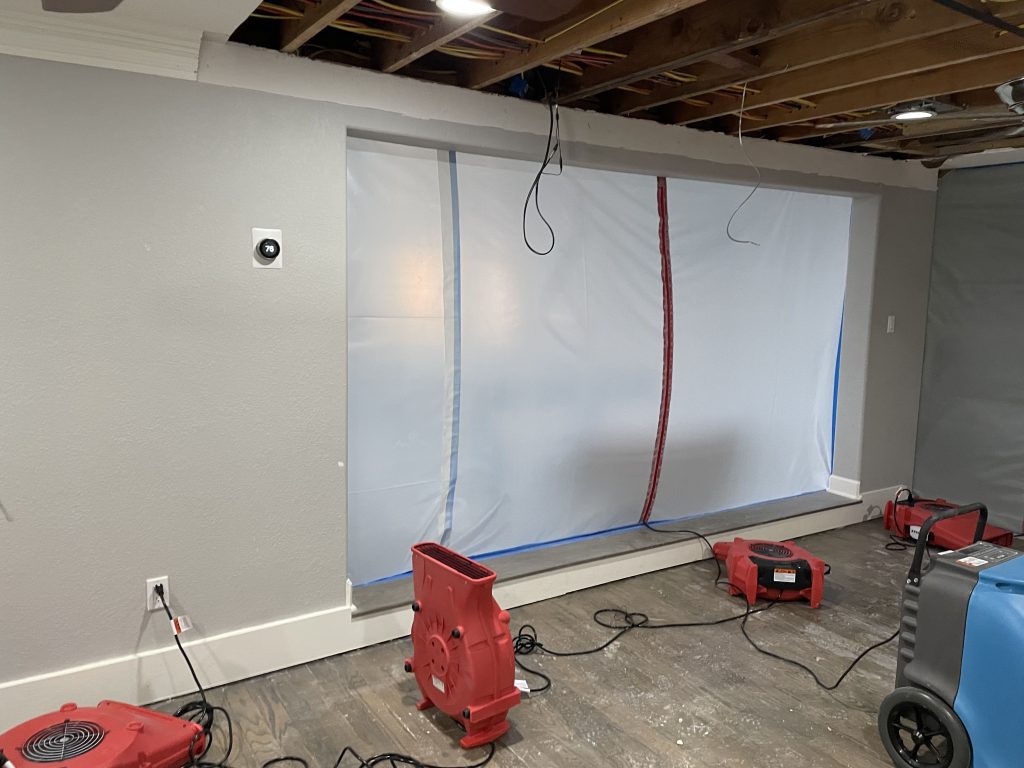 Water mitigation process during water damage restoration in Montgomery, effectively addressing water-related issues and minimizing damage.